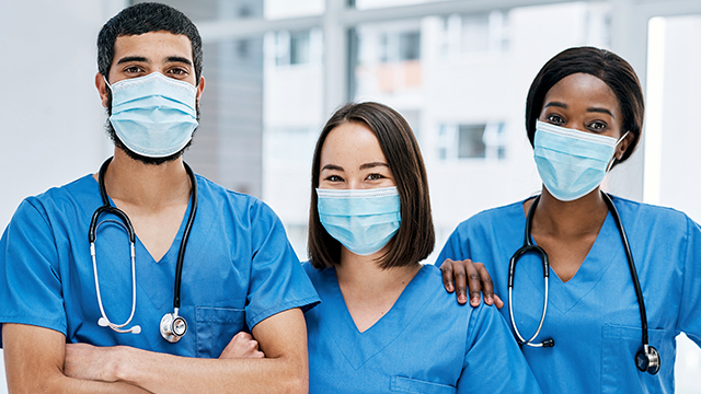 Three doctors with facemasks.