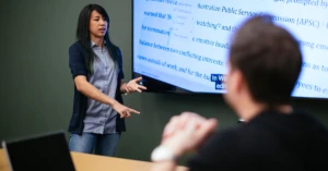 a group of people looking at a screen