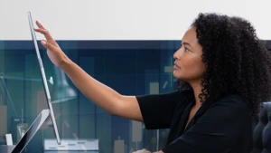 Woman using a touch screen monitor