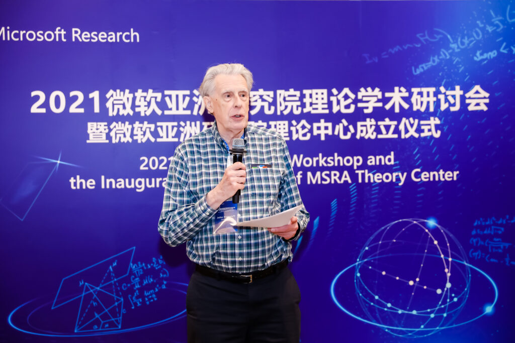 John Hopcroft standing on a stage