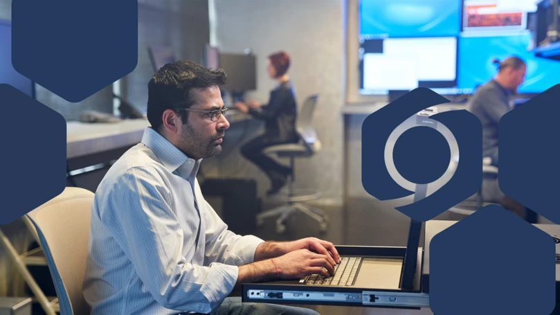 Photo of a SOC analyst working on a server