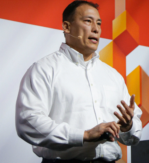 Fielder is shown giving a talk at an event.